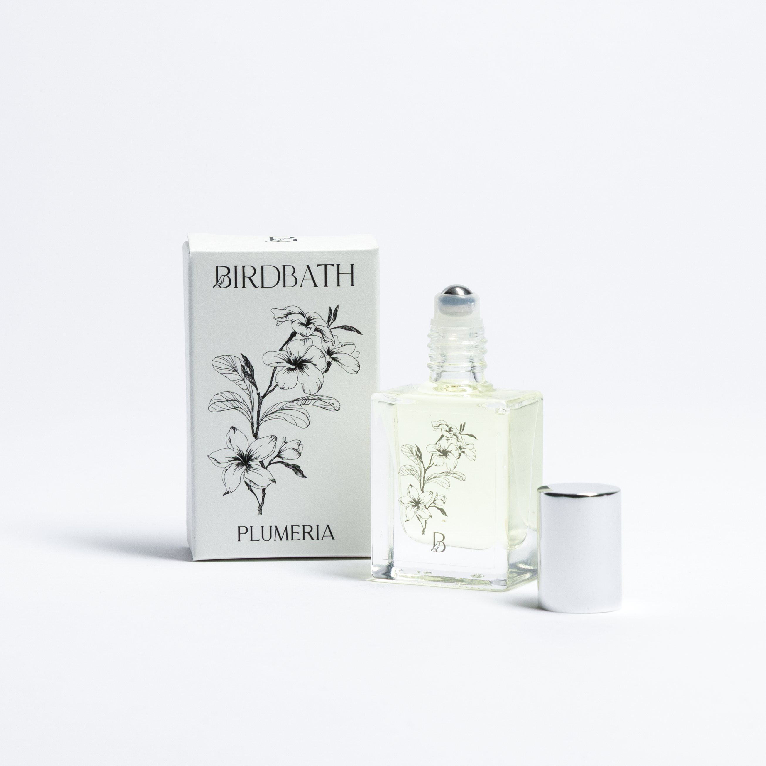Birdbath Plumeria perfume bottle and packaging on a white background