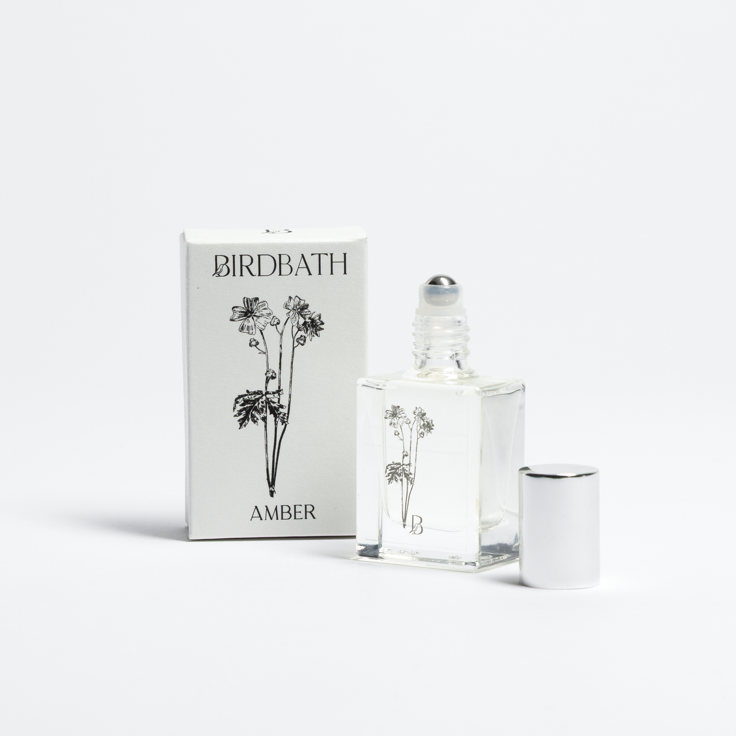 Birdbath Amber perfume bottle and packaging on a white background