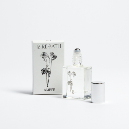 Birdbath Amber perfume bottle and packaging on a white background