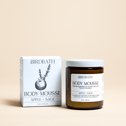 Birdbath Apple + Sage Body Mousse jar with a white product box on a cream background.