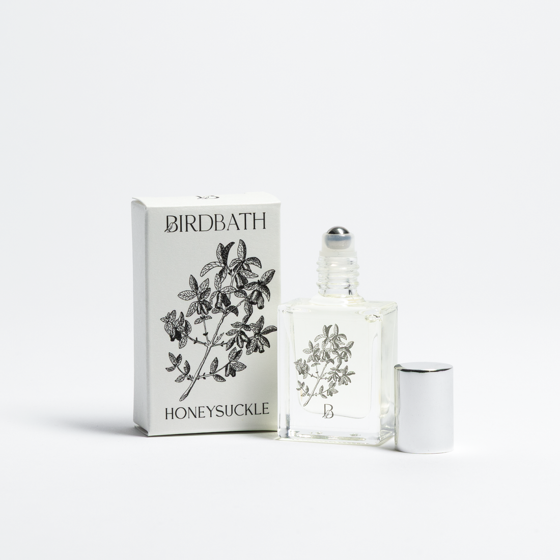 Birdbath Honeysuckle perfume bottle and packaging on a white background