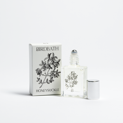 Birdbath Honeysuckle perfume bottle and packaging on a white background
