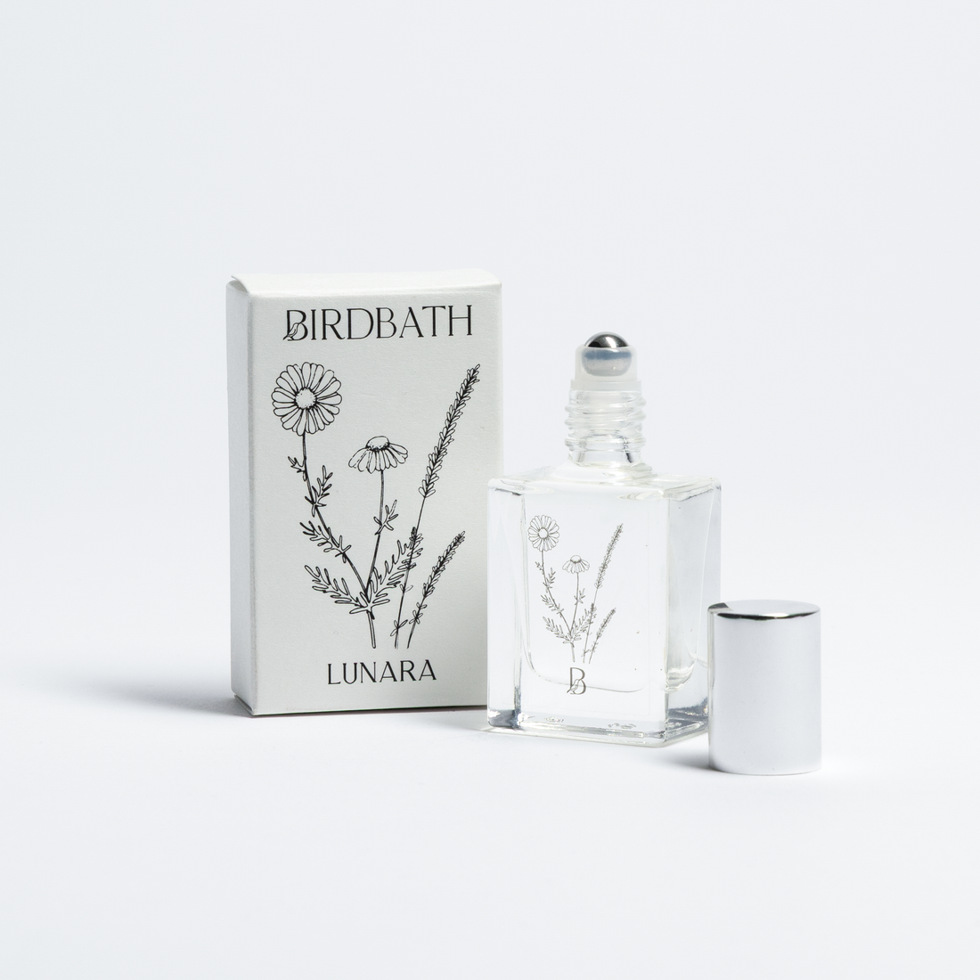 Birdbath Lunara Roll-on Perfume bottle with packaging on a white background.