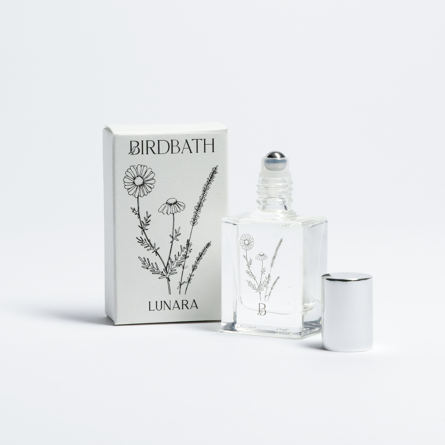 Birdbath Lunara Roll-on Perfume bottle with packaging on a white background.