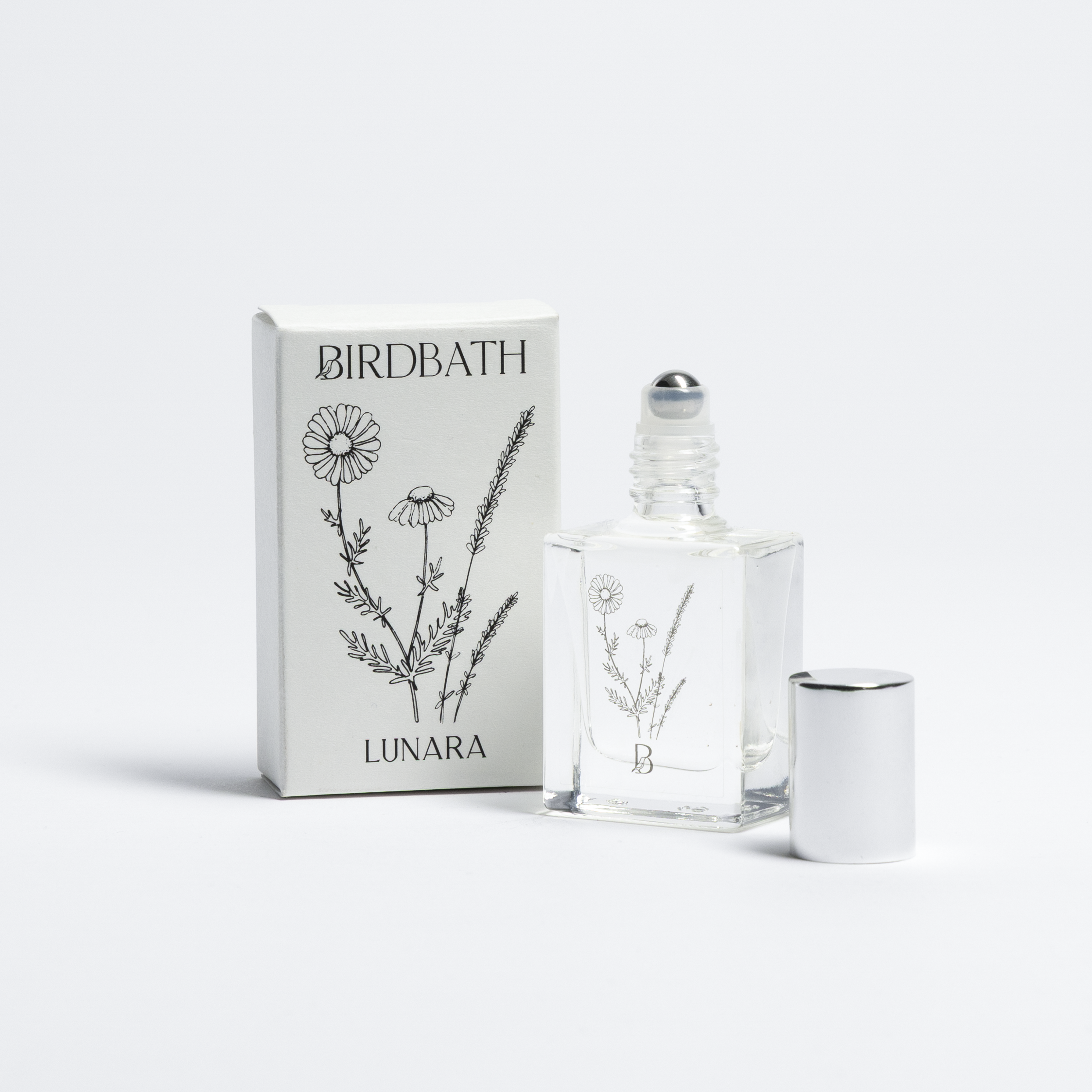 Birdbath Lunara Roll-on Perfume bottle with packaging on a white background.