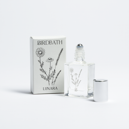 Birdbath Lunara Roll-on Perfume bottle with packaging on a white background.