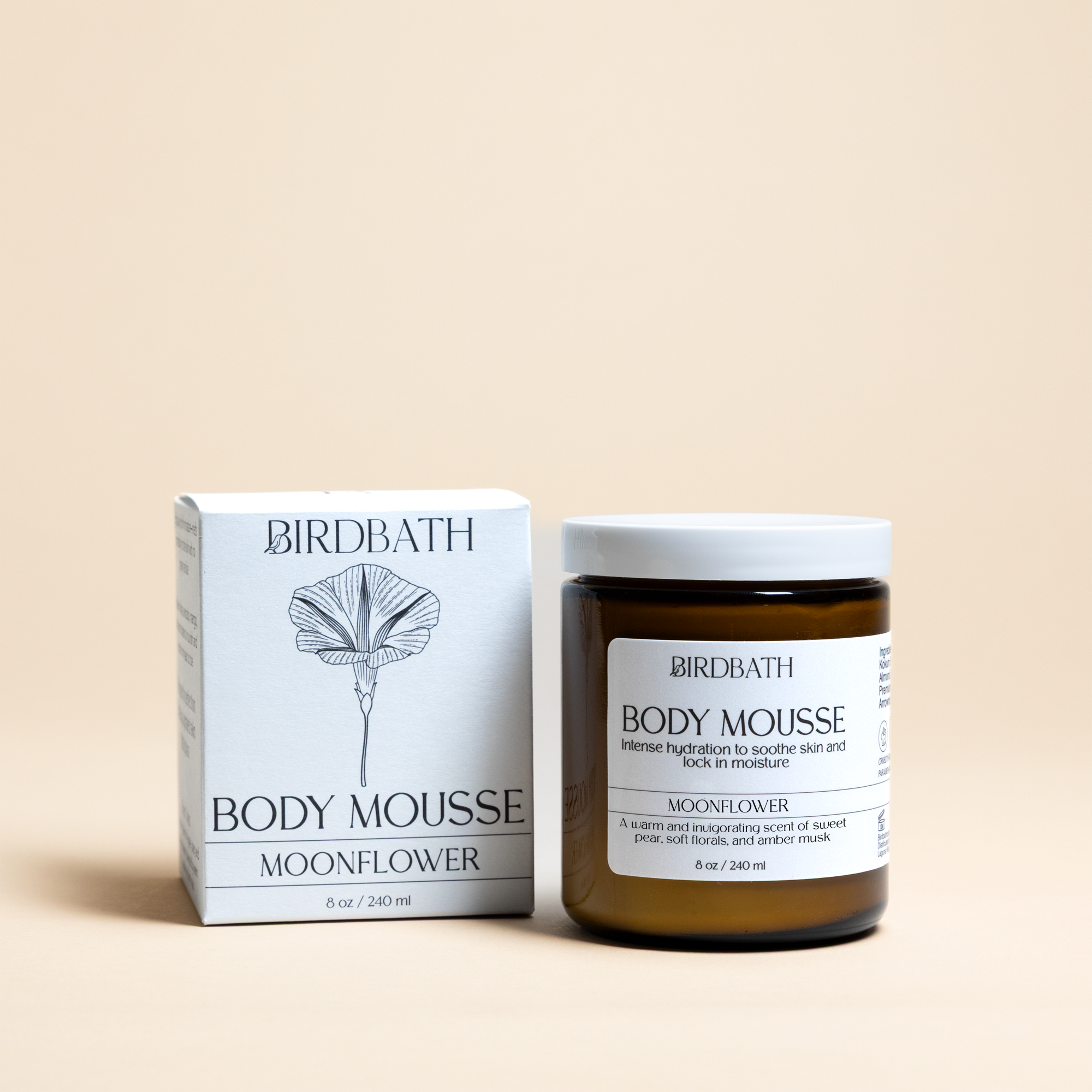 Birdbath Moonflower Body Mousse jar with a white product box on a cream background.