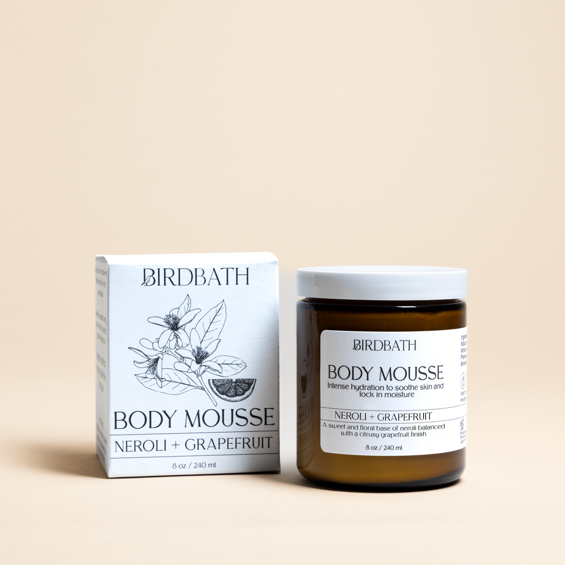 Birdbath Neroli + Grapefruit Body Mousse jar with a white product box on a cream background.