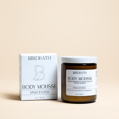 Birdbath Unscented Body Mousse jar with a white product box on a cream background.