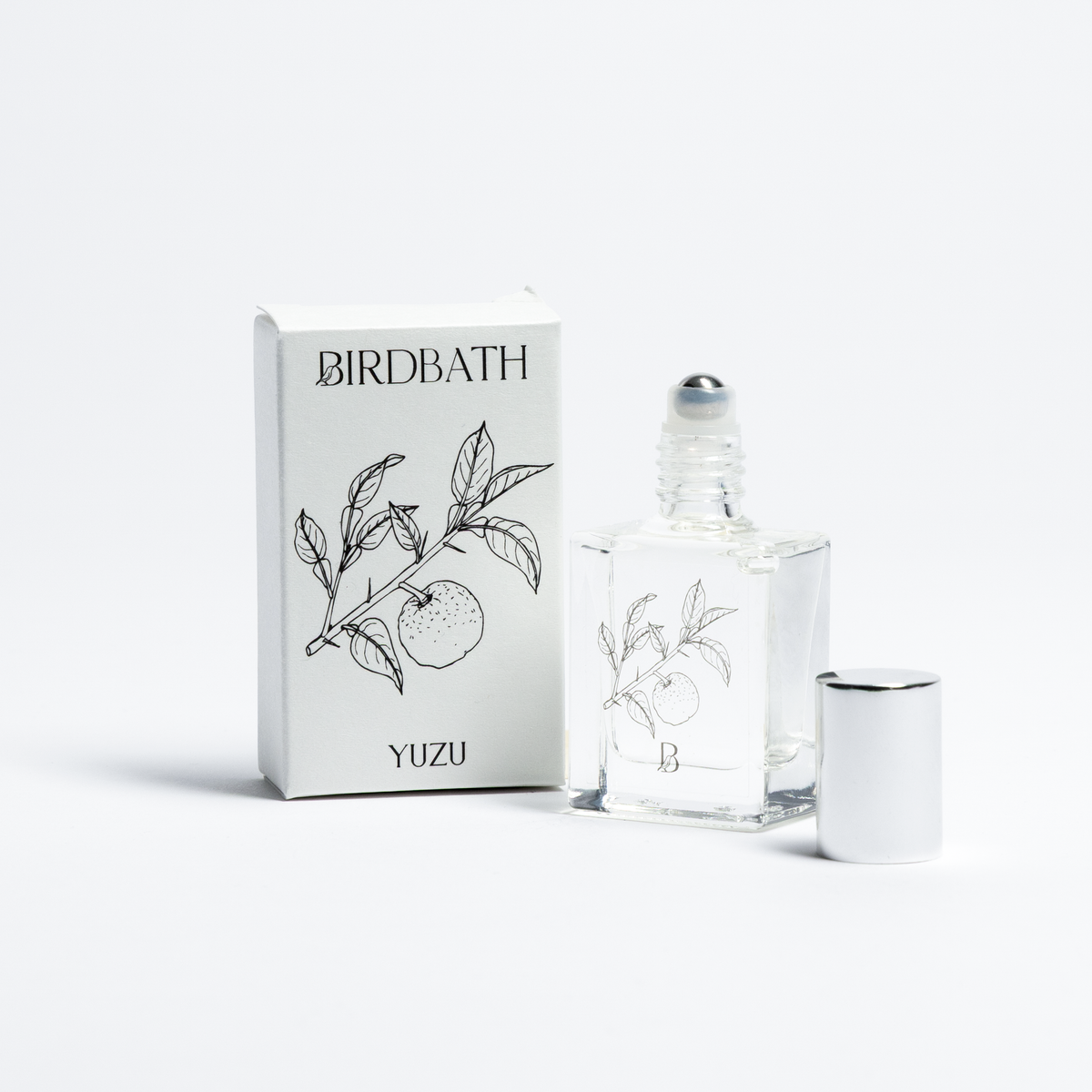 Birdbath Yuzu perfume bottle and packaging on a white background